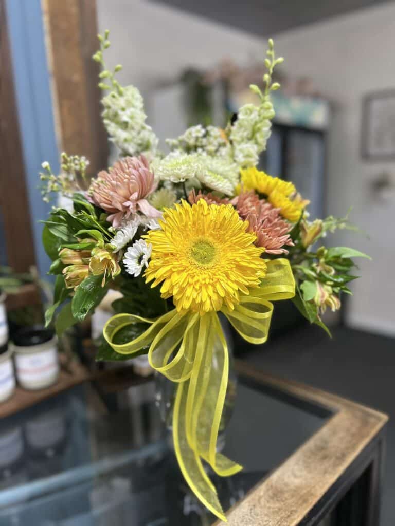 Yellow gerbera daisy floral arrangement.