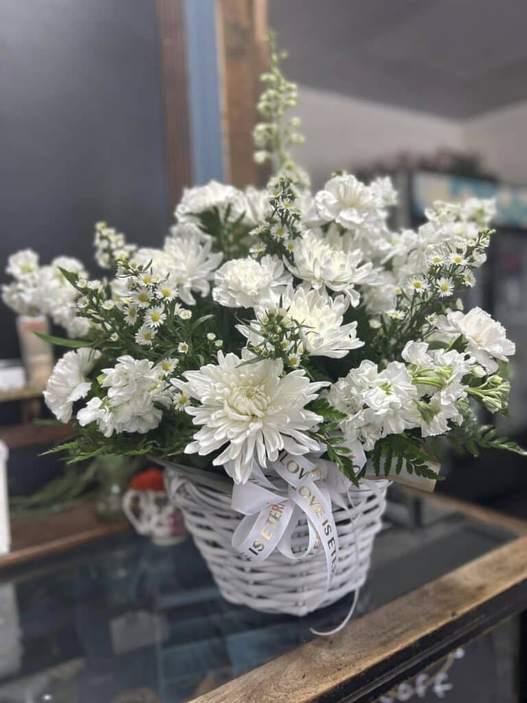 An all-white flower basket.
