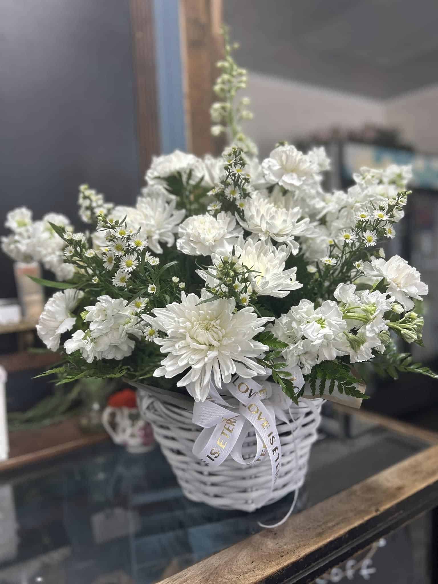 An all-white flower basket.
