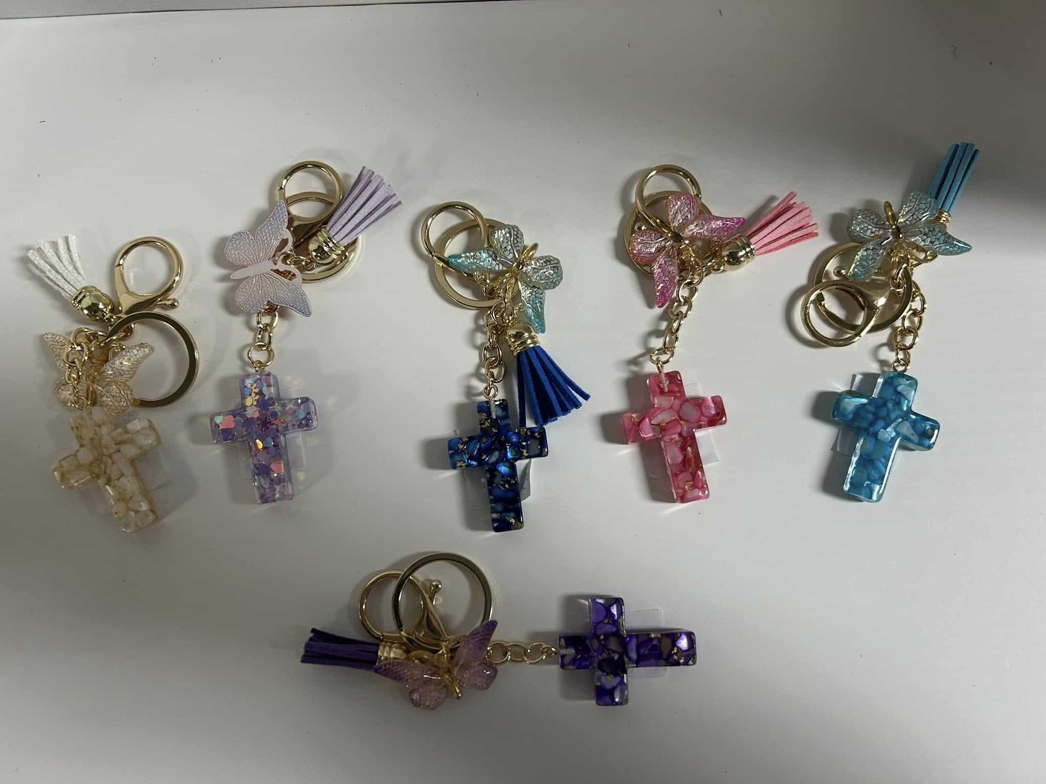 Assorted cross charm keychains.