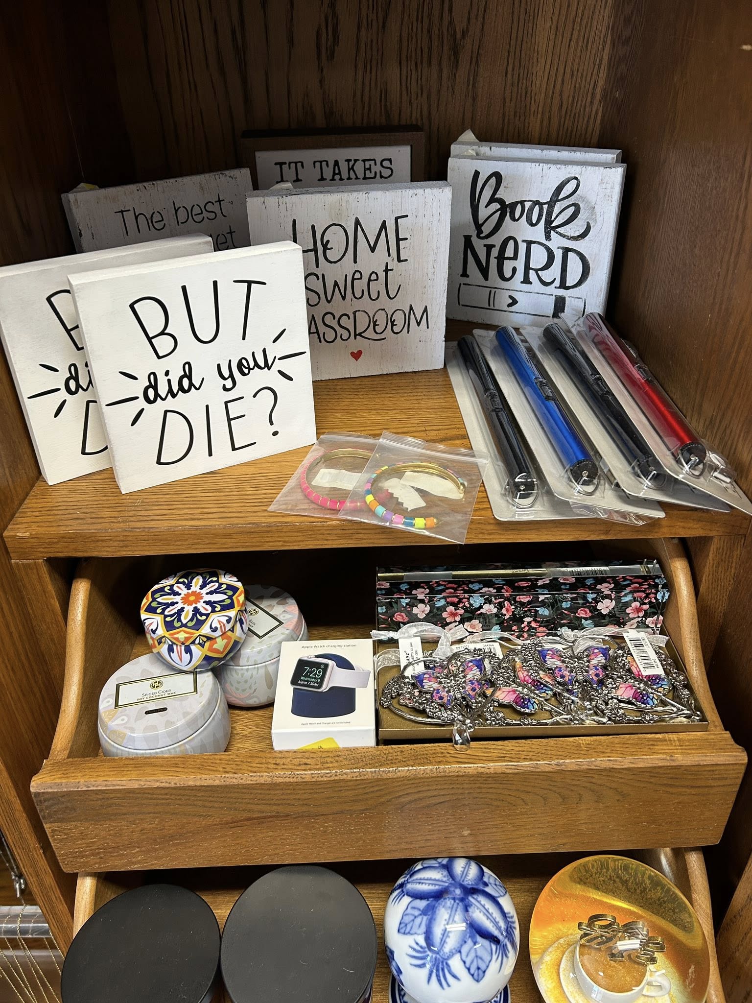 Assorted novelty gifts on shelves.