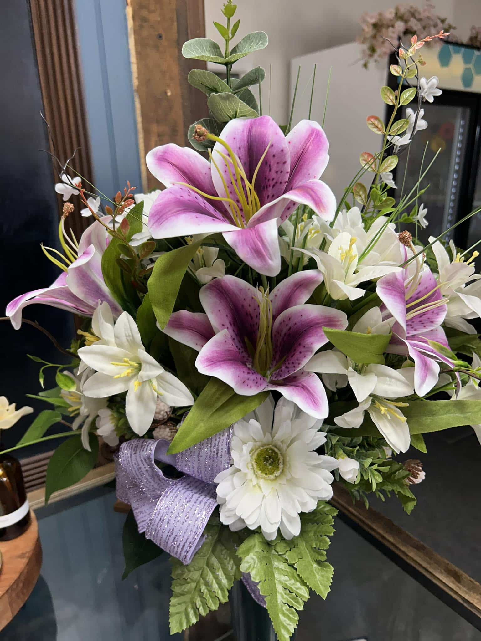 A purple and white lily flower bouquet.