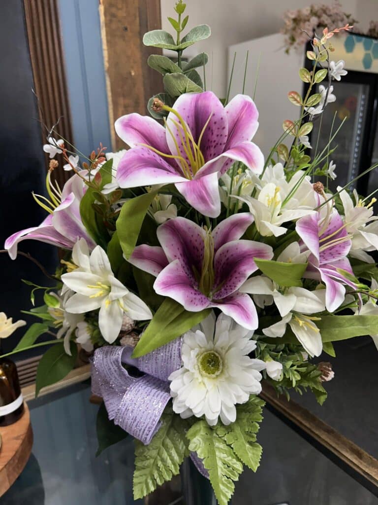 A purple and white lily flower bouquet.