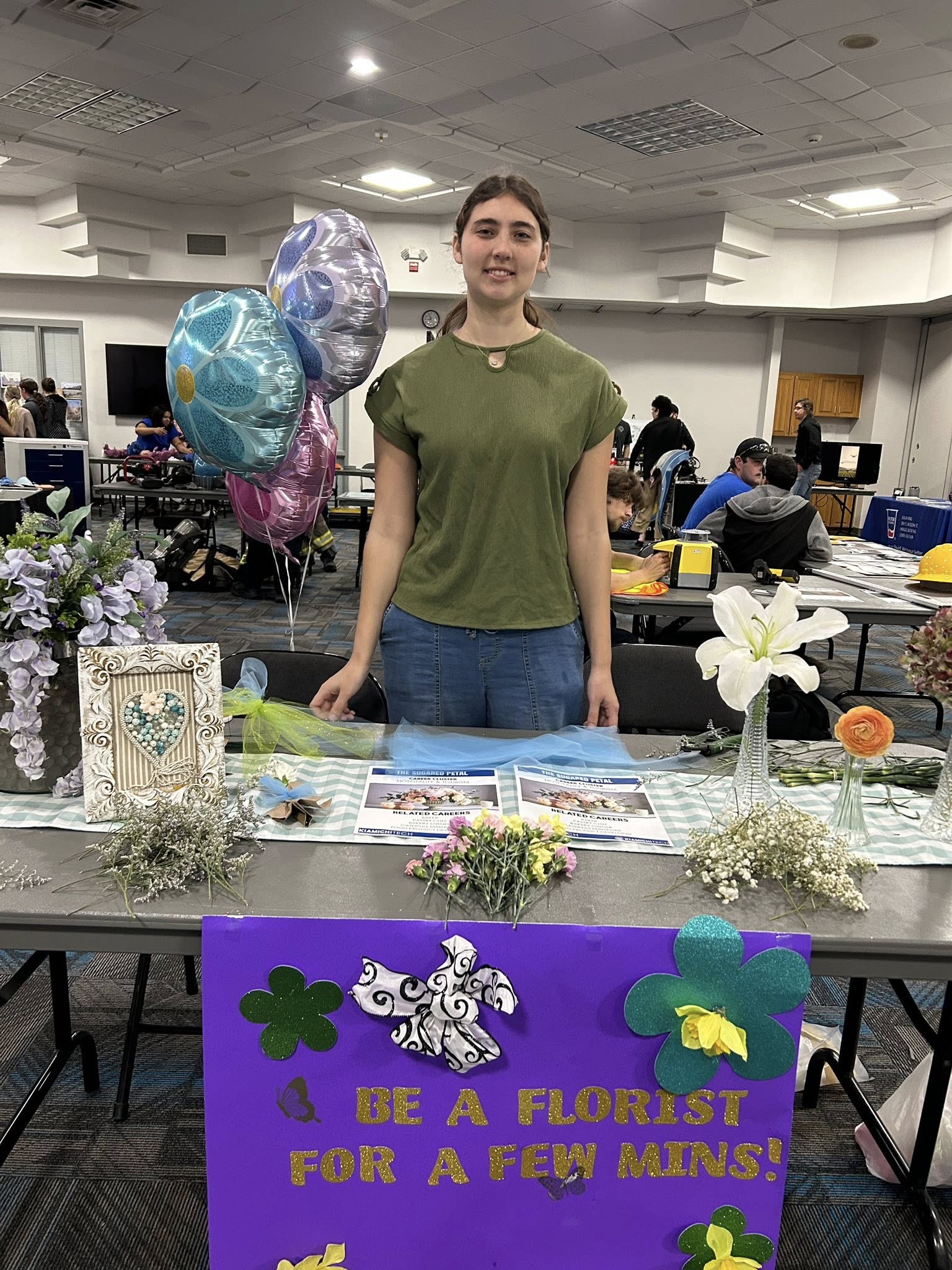 A student at a florist booth.